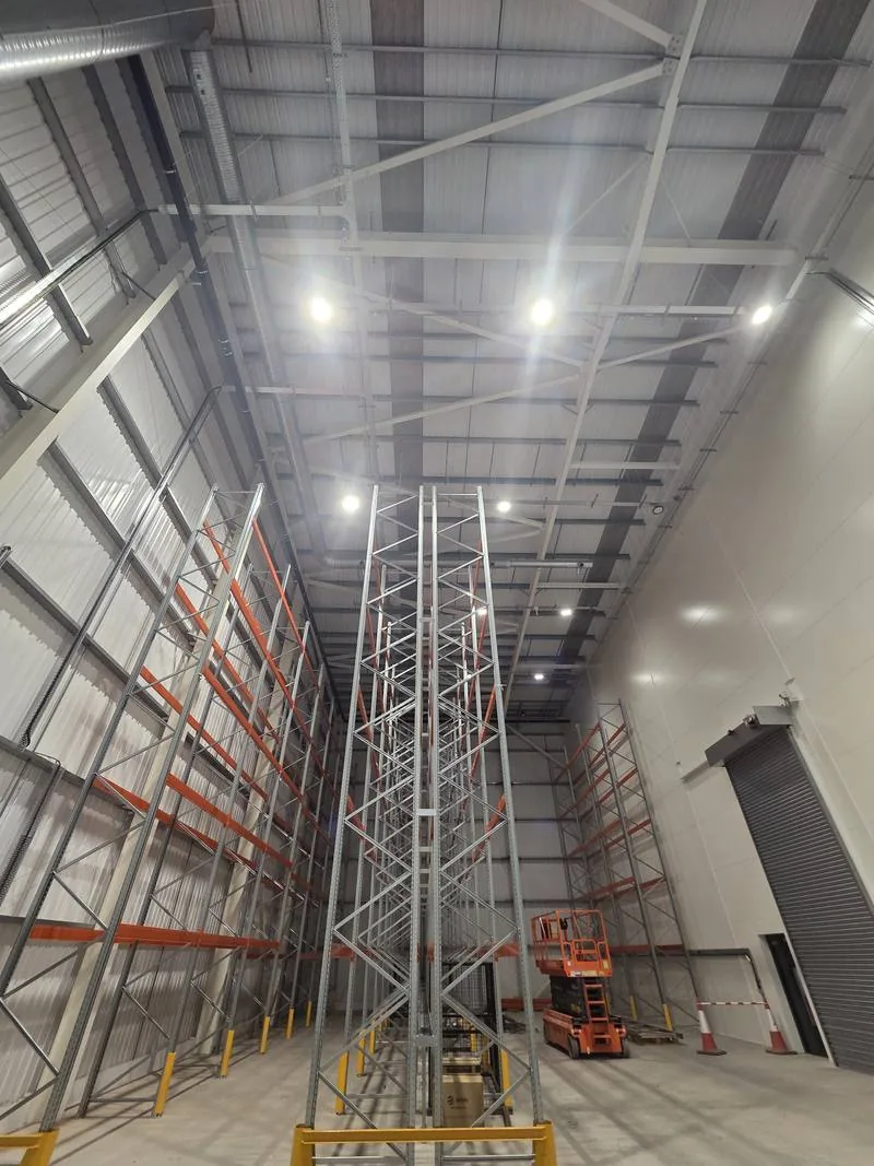 High-bay warehouse interior during fit-out