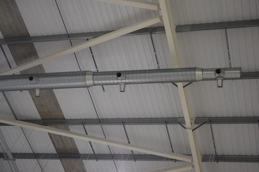 JET induction ductwork with nozzles at roof level in the warehouse