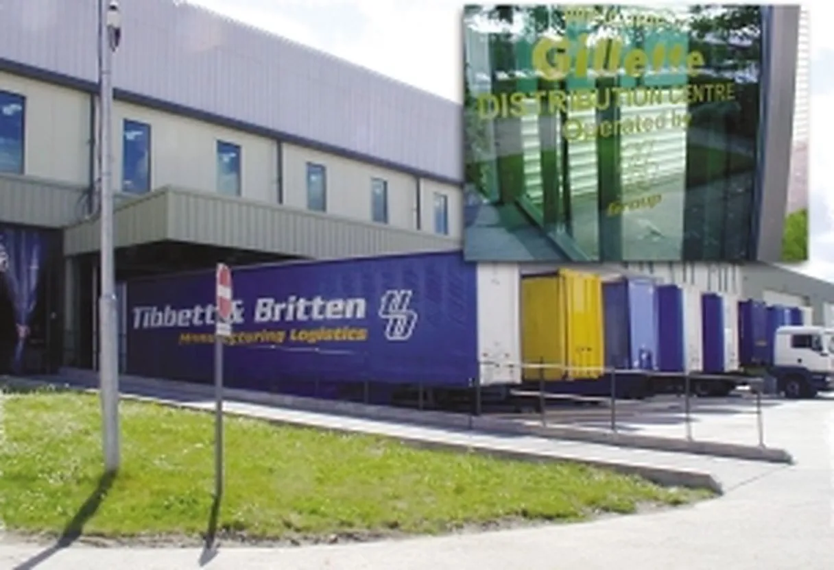 Exterior of the Gillette distribution centre at Manor Farm Industrial Estate, Reading, with loading bays and Tibbett & Britten trailers