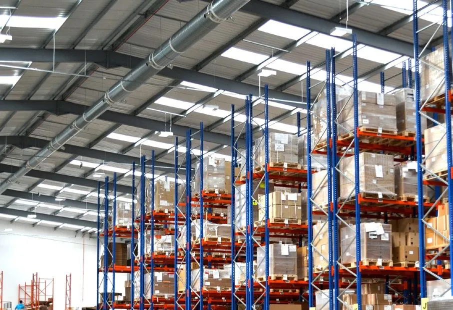 High-level ductwork above pallet racking