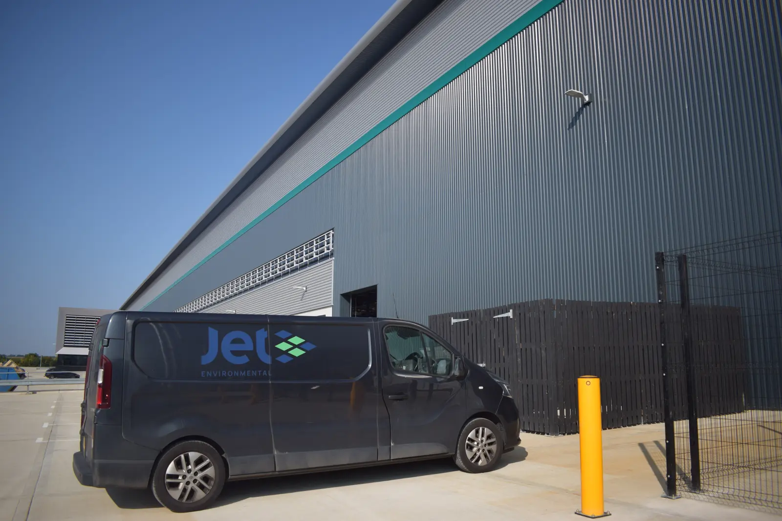 A Jet Environmental service van parked at a distribution centre